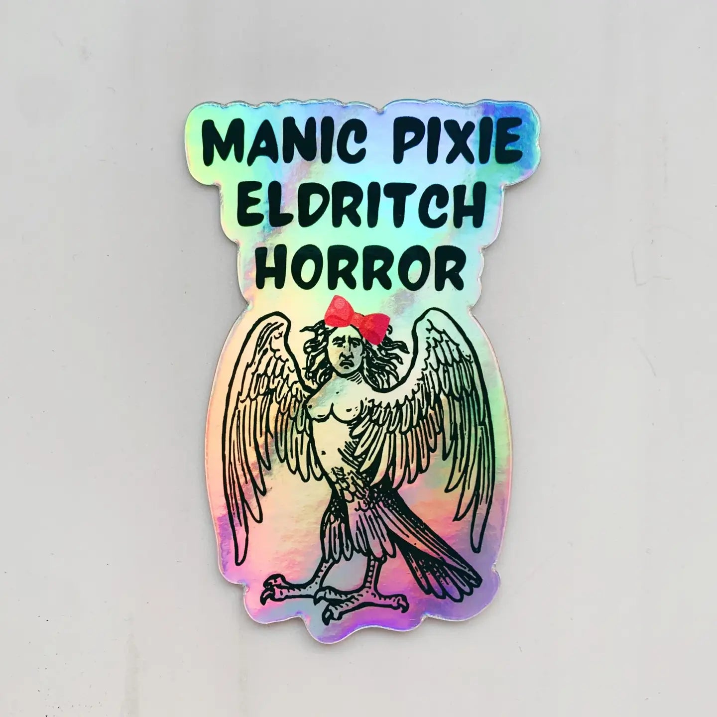 Manic Pixie Eldritch Horror Holographic Rainbow Sticker